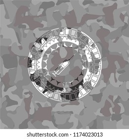 syringe icon inside grey camo texture