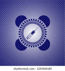 syringe icon inside jean or denim emblem or badge background