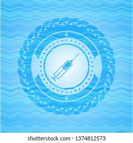 syringe icon inside light blue water badge.