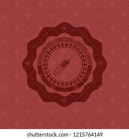 syringe icon inside red emblem