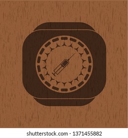 syringe icon inside retro style wooden emblem