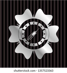 syringe icon inside silver shiny badge