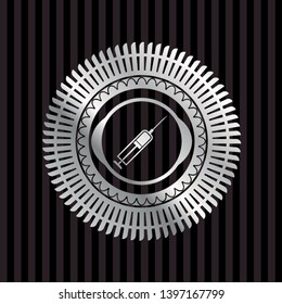 syringe icon inside silvery emblem or badge