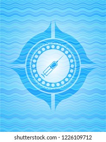 syringe icon inside sky blue water emblem.