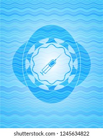 syringe icon inside sky blue water wave emblem background.