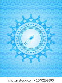 syringe icon inside sky blue water wave style emblem.
