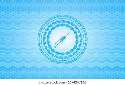 syringe icon inside sky blue water wave badge.
