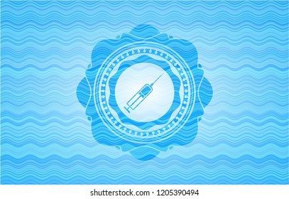 syringe icon inside water concept emblem background.