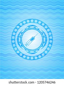 syringe icon inside water representation style emblem.