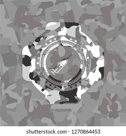 syringe icon on grey camo pattern