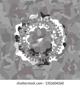 syringe icon on grey camo pattern