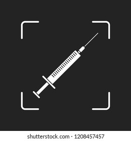 Syringe icon. White object in camera autofocus on dark background