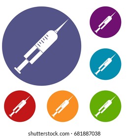 Syringe with needle icons set in flat circle red, blue and green color for web