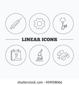 Syringe, stethoscope and microscope icons. Medical pills linear sign. Flat cogwheel and calendar symbols. Linear icons in circle buttons. Vector
