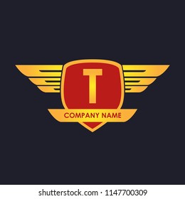 T initial shield with wings gold color logo