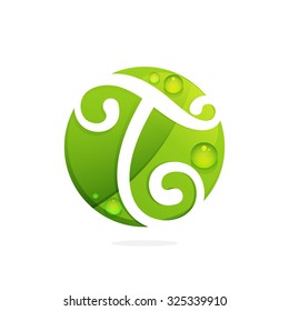 T letter with green leaves and dew drops. Vector design template elements for your application or corporate identity.