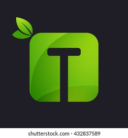 T letter logo with square and green leaves. 