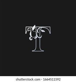 Letra T   Contorno al icono del logotipo de la hoja tropical de la naturaleza inicial. Diseño vectorial concepto de diseño monogramo vintage con logotipo color plata.