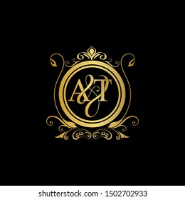 A & T AT logo initial Luxury ornament emblem. Initial luxury art vector mark logo, gold color on black background.