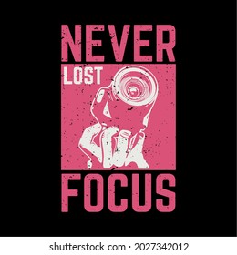 t shirt design never lost focus with hand holding a camera and black background vintage illustration
