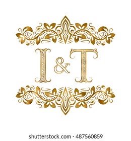 I and T vintage initials logo symbol. The letters are surrounded by ornamental elements. Wedding or business partners monogram in royal style.
