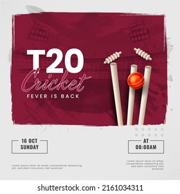 T20 Cricket Fever Is Back Font With 3D Silver Trophy Cup And Maroon Brush Stroke Effect On Gray Stadium Background.