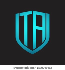 TA Logo monogram with emblem shield design isolated with blue colors on black background