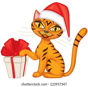 Tabby red cat in cap Santa gives a gift tied with red ribbon