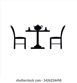 Table and chairs icon. Vector illustration