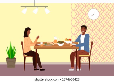 Table with fruit, salad and sandwiches. Family is eating natural food. Characters in relationship are having date in the restaurant. Afro American people are communicating and spending time together