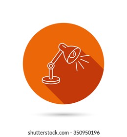 Table lamp icon. Desk light sign. Round orange web button with shadow.