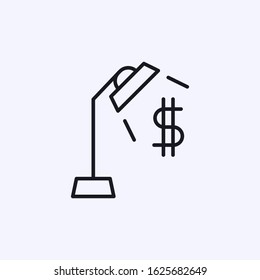 Table lamp illuminating the dollar icon