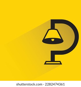 table lamp with shadow on yellow background