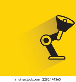 table lamp with shadow on yellow background