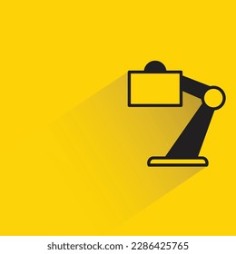 table lamp with shadow on yellow background