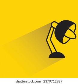 table lamp with shadow on yellow background