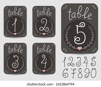 Table number plates and a full set of numbers. Cards for wedding or holiday decoration. White handwritten numbers on a black chalkboard. Vector illustration
