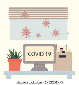 the table on which the computer is located, where it is written covid-19, a box with the employee's belongings