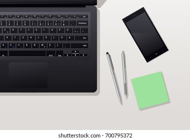 table with phone and the laptop