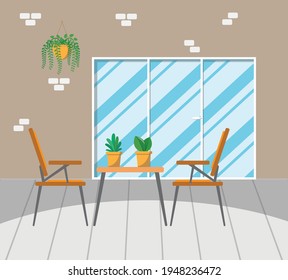 A table with plants. Gardener's workplace. Interior of a balcony or room with plants.