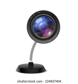 Table souvenir in form of photo camera lens on spring