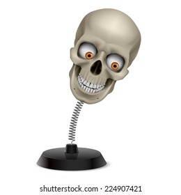 Table souvenir with grinning human skull on spring