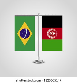 Table stand with flags of Brazil and Afghanistan.Two flag. Flag pole. Symbolizing the cooperation between the two countries. Table flags
