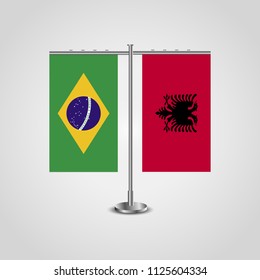 Table stand with flags of Brazil and Albania.Two flag. Flag pole. Symbolizing the cooperation between the two countries. Table flags
