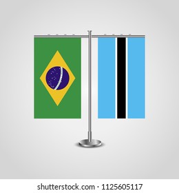 Table stand with flags of Brazil and Botswana.Two flag. Flag pole. Symbolizing the cooperation between the two countries. Table flags