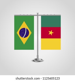 Table stand with flags of Brazil and Cameroon.Two flag. Flag pole. Symbolizing the cooperation between the two countries. Table flags
