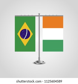 Table stand with flags of Brazil and Côte d'Ivoire.Two flag. Flag pole. Symbolizing the cooperation between the two countries. Table flags
