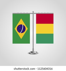 Table stand with flags of Brazil and Guinea.Two flag. Flag pole. Symbolizing the cooperation between the two countries. Table flags
