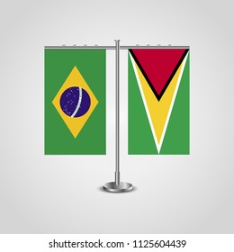 Table stand with flags of Brazil and Guyana.Two flag. Flag pole. Symbolizing the cooperation between the two countries. Table flags
