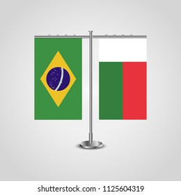 Table stand with flags of Brazil and Madagascar.Two flag. Flag pole. Symbolizing the cooperation between the two countries. Table flags